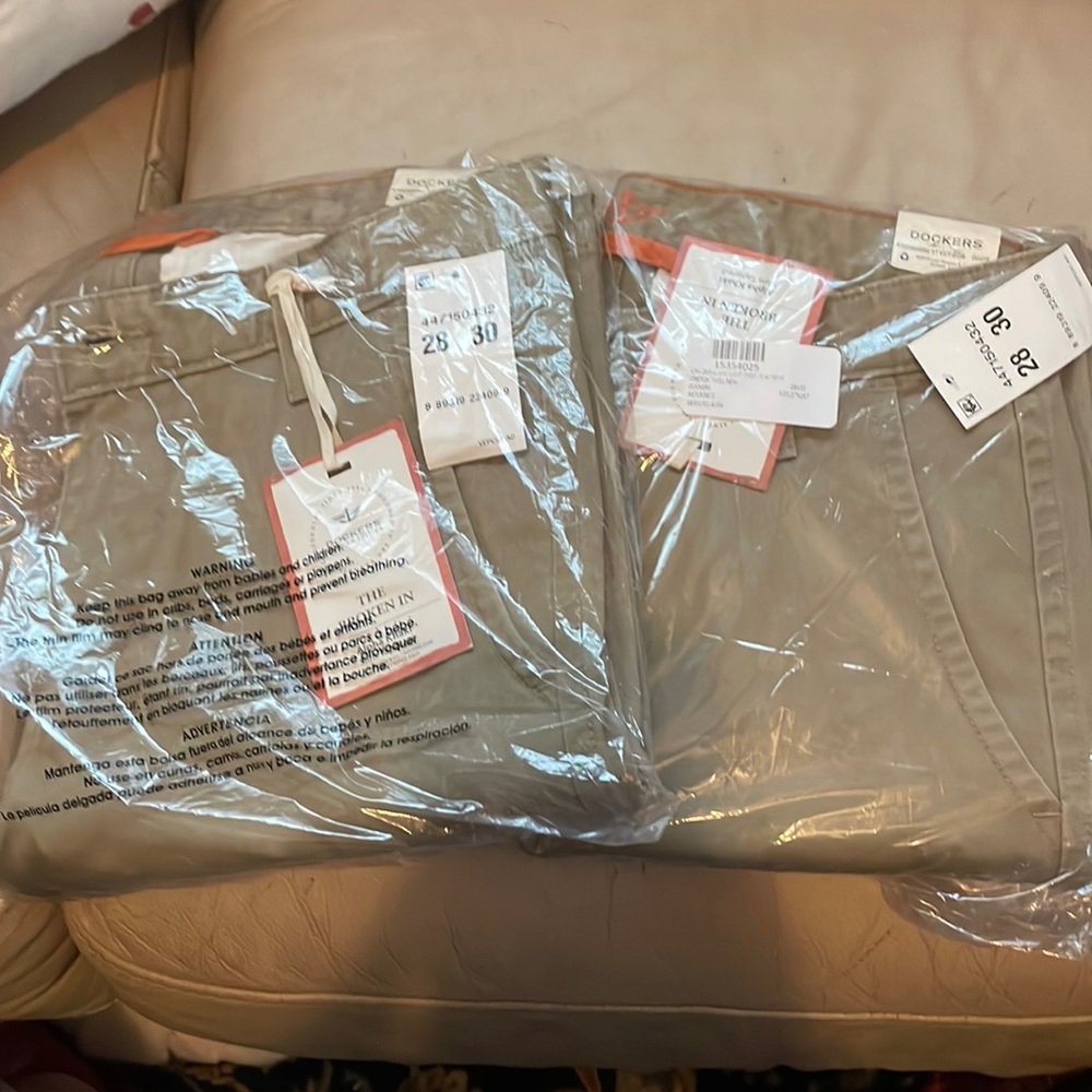 TWO pairs of Dockers 28x30 khakis. BNWT, just bought wrong size, can sell apart.